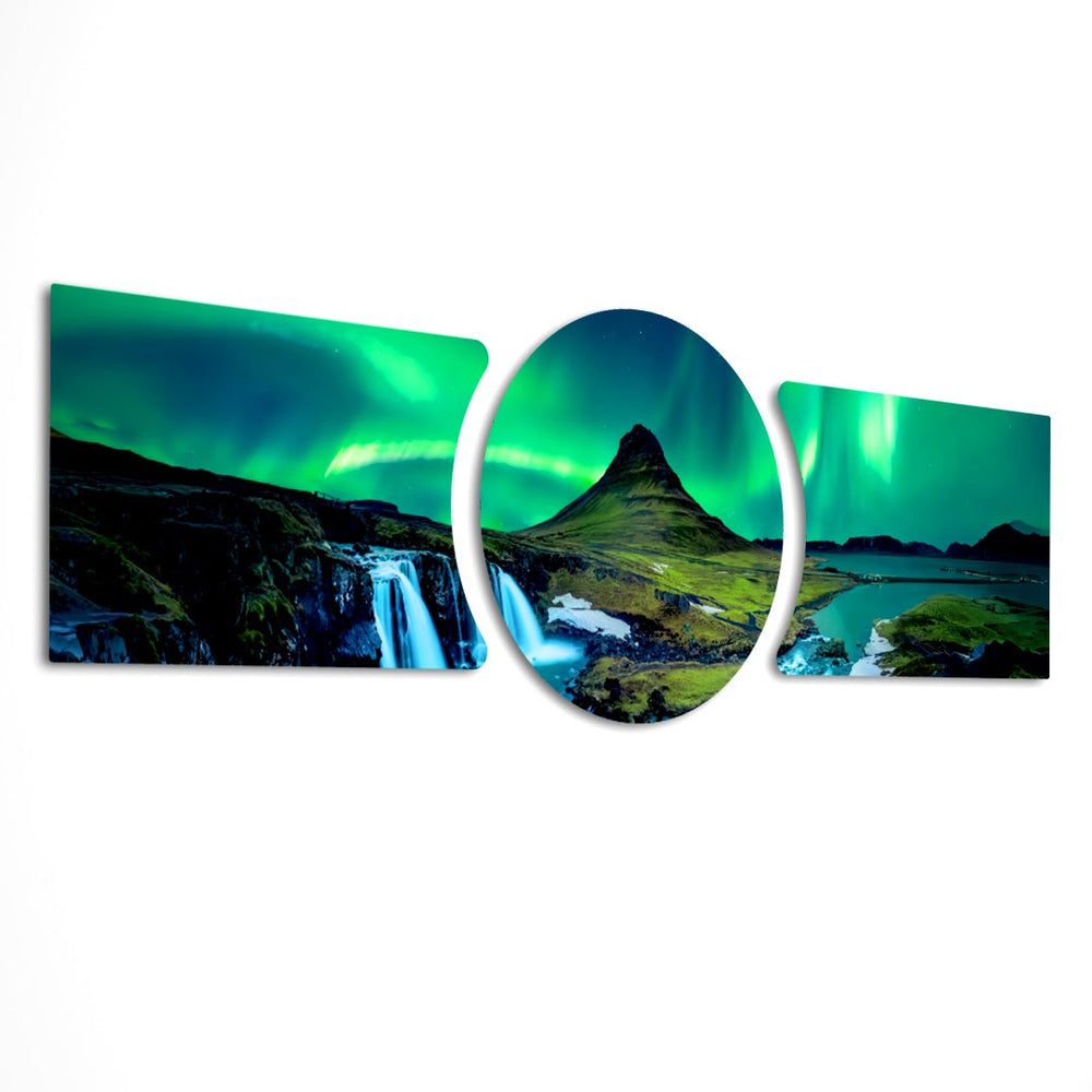 Green northern lights swirling over a peaked mountain, waterfall and calm fjord at night. 3 piece glass wall art set E
