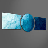 Abstract flowing water in shades of blue, from pale aqua foam to deep navy depths. 3 piece glass wall art set F