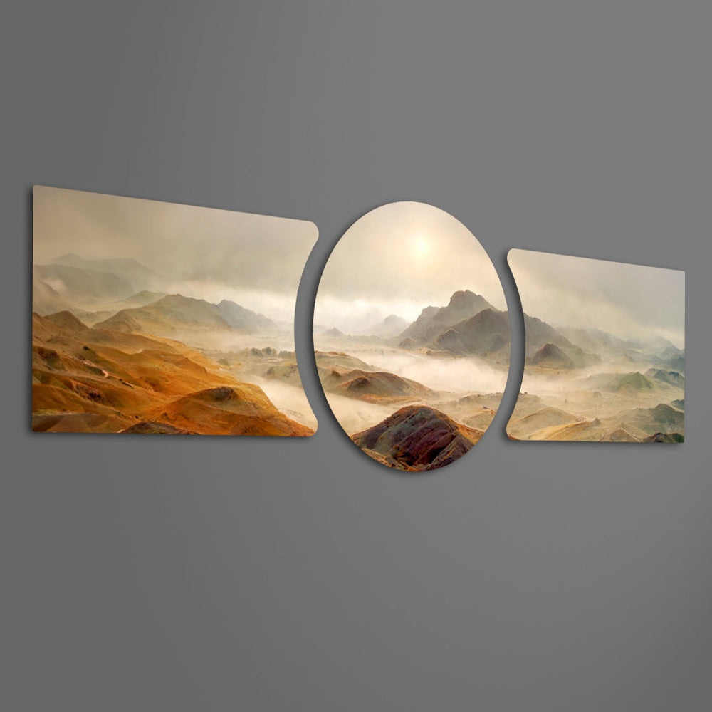 A vast dawn landscape of golden-brown mountain ridges wrapped in low fog, with a soft sun glowing through the haze 3 piece glass wall art set F