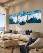 A powerful ocean wave breaking into white foam and spray across deep blue and teal water under a soft sky 3 piece glass wall art set C