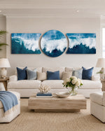 A powerful ocean wave breaking into white foam and spray across deep blue and teal water under a soft sky 3 piece glass wall art set D