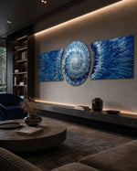 An abstract 3D starburst of blue and silver shards radiating outward from a bright glowing white center. 3 piece glass wall art set D