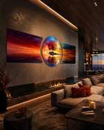 A vivid multicolored tree standing on a small island, perfectly mirrored in calm water beneath a blazing sunset sky. 3 piece glass wall art set B