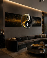 A yin yang symbol formed from pale moon-like smoke and dark smoke, framed in gold on a black ground with drifting golden sparks. 3 piece glass wall art set E