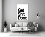 Get Shit Done glass wall art catching light to reveal its high-contrast typography