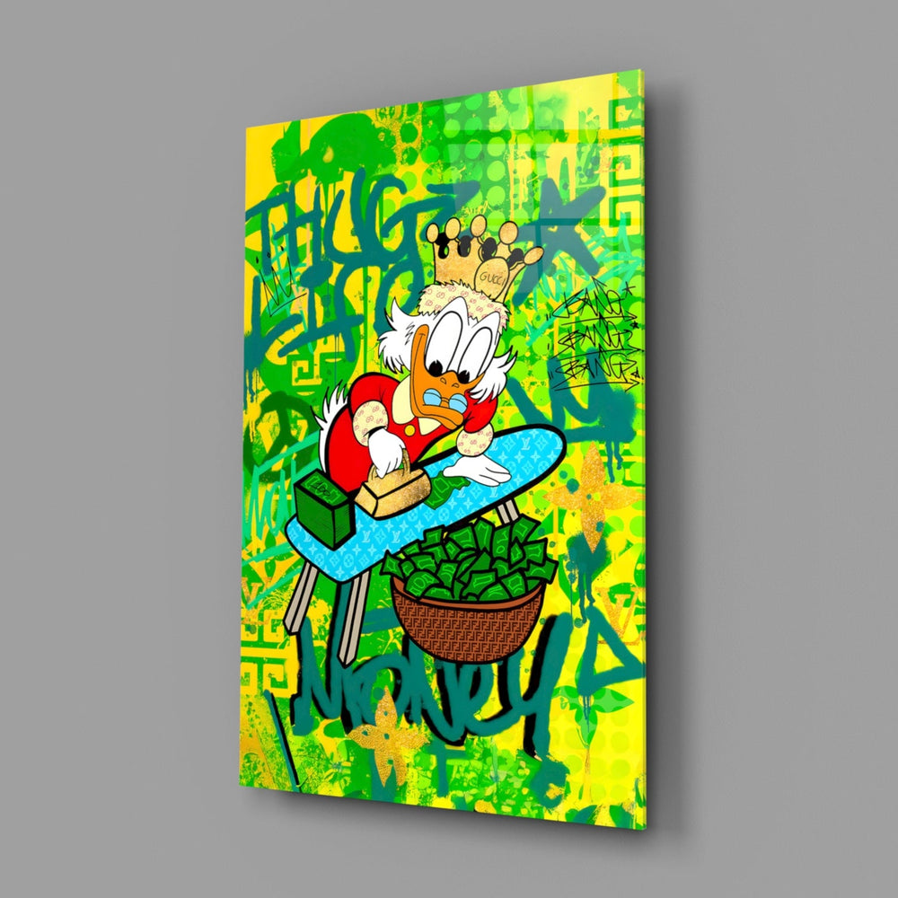 Close-up detail of Scrooge on gold scooter with money graffiti behind glass