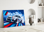 Close-up detail of the BMW M2 and M-Sport stripes behind glass