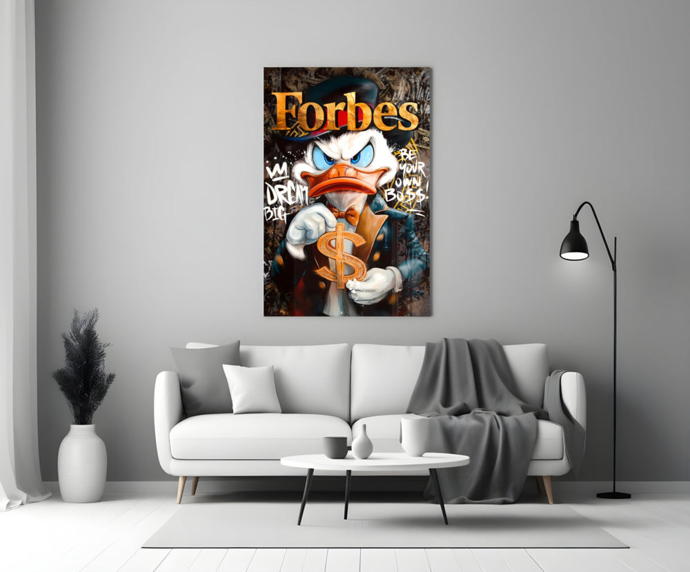Close-up detail of Scrooge with gold dollar sign and Forbes typography behind glass