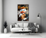Close-up detail of Scrooge with gold dollar sign and Forbes typography behind glass