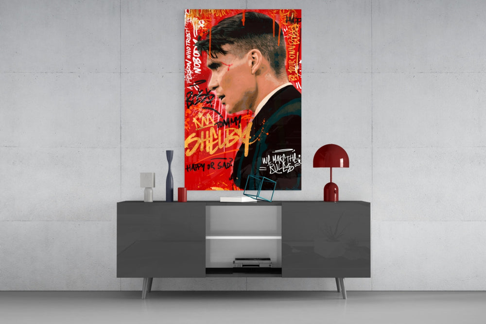 Tommy Shelby glass wall art catching light to reveal its painterly graffiti