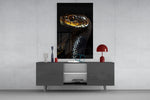 Golden-Eyed Black Snake glass wall art catching light to reveal its scale gleam