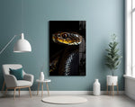 Black snake portrait artwork styled in an executive office