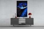 Blue Viper glass wall art catching light to reveal its scale gleam