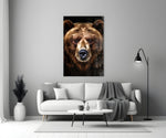 Close-up detail of the grizzly bear and amber eyes behind glass