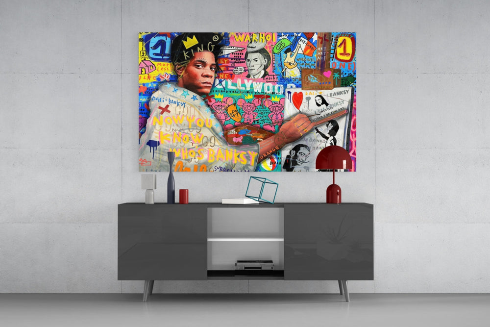 Banksy's Basquiat glass wall art catching light to reveal its layered tags