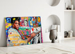 Close-up detail of Basquiat with paper-crown and brush behind glass