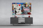 Banksy's Picasso glass wall art catching light to reveal its layered tags