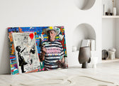 Close-up detail of Picasso holding Banksy canvas behind glass