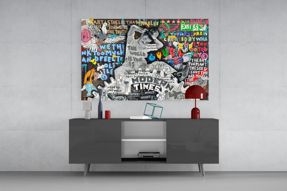 Modern Times glass wall art catching light to reveal its layered tags