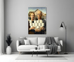 Close-up detail of American Gothic couple holding toilet paper rolls behind glass