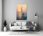 Close-up detail of sailboat heading into sunset behind glass