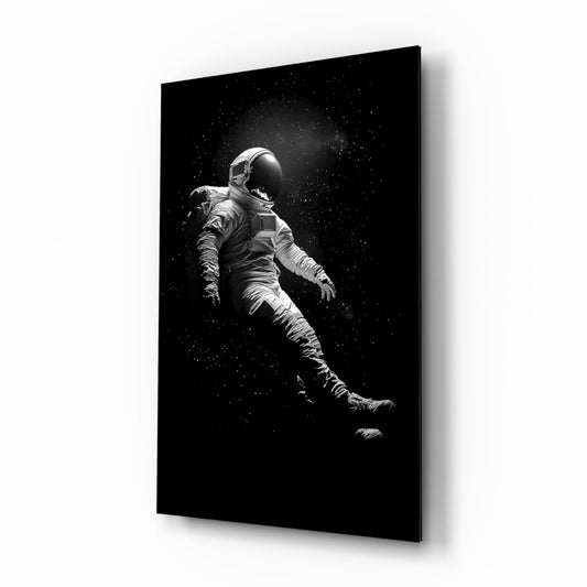 Loneliness in Space astronaut glass wall art displayed above a console in a designer interior