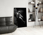 Astronaut panel anchoring a home office wall with minimalist focus