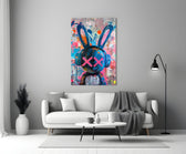 Close-up detail of graffiti rabbit with headphones behind glass