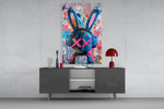 Graffiti Rabbit glass wall art catching light to reveal its layered tags
