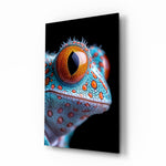 Cosmic Eyes gecko glass wall art in a modern living room