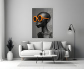 Close-up detail of bald female bust with tangerine sunglasses behind glass