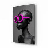 Faces of Colors magenta glass wall art in a modern boutique