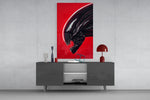 Alien Red Menace glass wall art catching light to reveal its painted ridges
