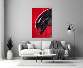 Close-up detail of Xenomorph head on scarlet field behind glass