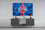 Detroit Pistons banner glass wall art catching light to reveal its painted ripples