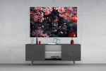 Lion of the Night glass wall art catching light to reveal its painted blossoms