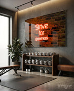 LeBron Strive for Greatness glass wall art in a modern home gym