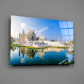 Thai sacred architecture pearl-white spires glass wall art over modern living-room sofa