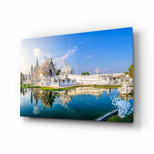 Wat Rong Khun White Temple reflection glass wall art above a walnut console with white orchid