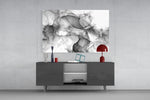 Translucent black-ink swirl glass wall art in luxury spa relaxation room