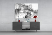 Translucent black-ink swirl glass wall art in luxury spa relaxation room