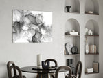 Monochrome fluid-art ink glass wall art above modern dining sideboard
