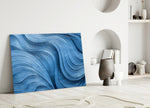 Sapphire-and-silver wave abstract glass wall art in calm dining room