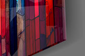 Cathedral-color mosaic glass wall art in designer dining room with brass fixtures