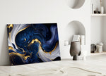 Gold-flecked navy abstract glass wall art over master-bedroom headboard