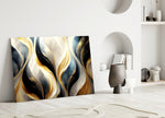 Ivory-pearl and gold-flame cinematic glass wall art over master-bedroom headboard