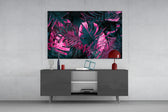 Stage-lit tropical leaf glass wall art in nightclub-style home bar