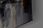 Charcoal-and-ivory feather glass wall art in boutique-hotel lounge