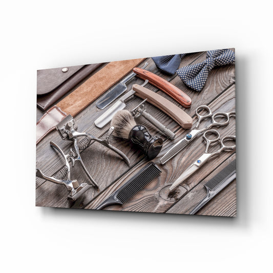 Vintage barber tools flat-lay cinematic glass wall art above barbershop leather chair