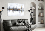 Mirrored-skyline abstract glass wall art in boutique-hotel reception